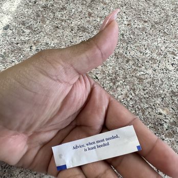 Zen Mei Bistro - a hand holding a piece of paper with a poem written on it - Chinese Near Me - Los Angeles, California