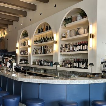 Issabella's - a bar with blue stools - Mediterranean Near Me - Miami Beach, Florida