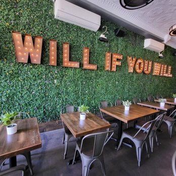 Key & Cleaver - a dining area with tables and chairs - Burgers Near Me - San Diego, California