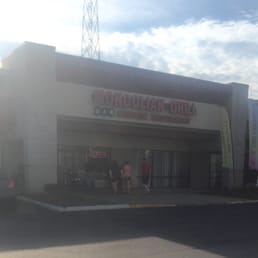 people walking in front of the restaurant