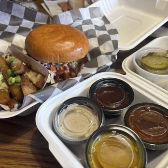 Smokin Oak BBQ - Brisket sandwich with the Jojo potatoes and one of each sauce to try it out. - Barbeque Near Me - Mariposa, California Smokin Oak BBQ - Brisket sandwich with the Jojo potatoes and one of each sauce to try it out. - Barbeque Near Me - Mariposa, California