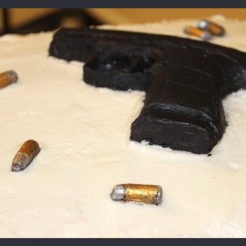 Strawn Cakes and Bakes - Everyone thought it was a real pistol and rounds but nope just fondant!! - Custom Cakes Near Me - Strawn, Texas