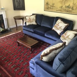 Classic Home Furnishings - Handmade Persian Rug and Custom made Velvet Henredon Sofas.