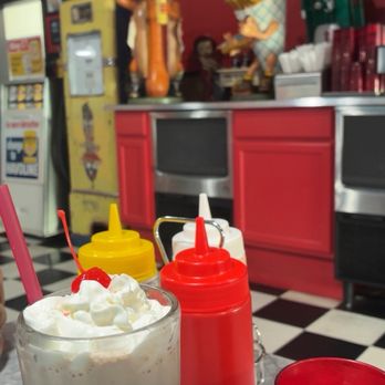 Dutch Mill Diner - Milkshake with fun decor in background - Diners Near Me - Tillamook, Oregon