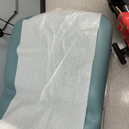 Blood from previous patients. And paper on chair was not changed. Blood from previous patients. And paper on chair was not changed.