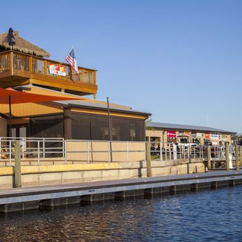 St John's River Grille - Screened in porch is great to keep away from bugs. But the view from the roof-deck tiki bar is wonderful! - New American Near Me - DeLand, Florida St John's River Grille - Screened in porch is great to keep away from bugs. But the view from the roof-deck tiki bar is wonderful! - New American Near Me - DeLand, Florida