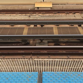 CTA - Belmont [Red, Brown, Purple ] - Cool industrial view down onto the tracks at Belmont El station. - Public Transportation Near Me - Chicago, Illinois