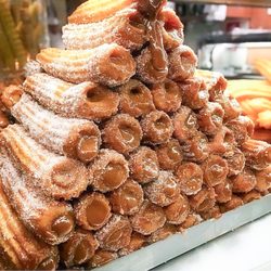 Churros El Abuelo - A mountain of churros doused in cinnamon and sugar