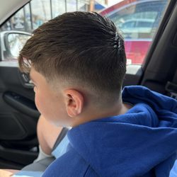 Valor3 Barbers + Brews - Low taper fade with a textured fringe