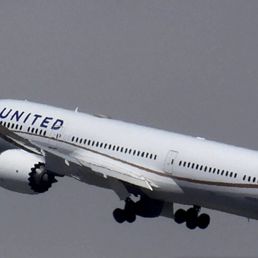 United, just taking off with wheels coming up United, just taking off with wheels coming up