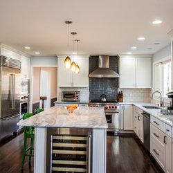 Tile Center - Modern white kitchen with island and beveled subway tile. design and installed by Tile Center