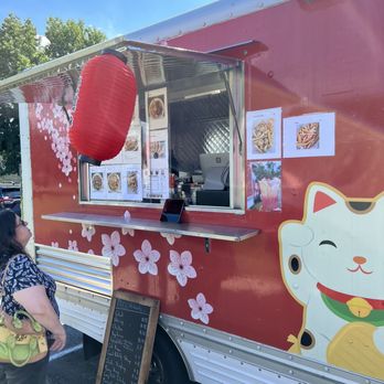 TCC's Hibachi - a woman standing in front of a food truck - Thai Near Me TCC's Hibachi - a woman standing in front of a food truck - Thai Near Me