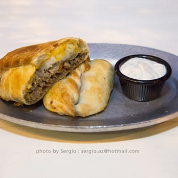 Cornish Pasty - Cottage Pie split with the Chicken Tikka which is the half you can't see inside. The yogurt sauce for the Chicken Tikka Masala - British Near Me - Tempe, Arizona