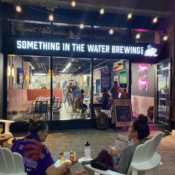 Something In The Water Brewing - two people sitting outside of a restaurant - Breweries Near Me - Toronto, Ontario Something In The Water Brewing - two people sitting outside of a restaurant - Breweries Near Me - Toronto, Ontario