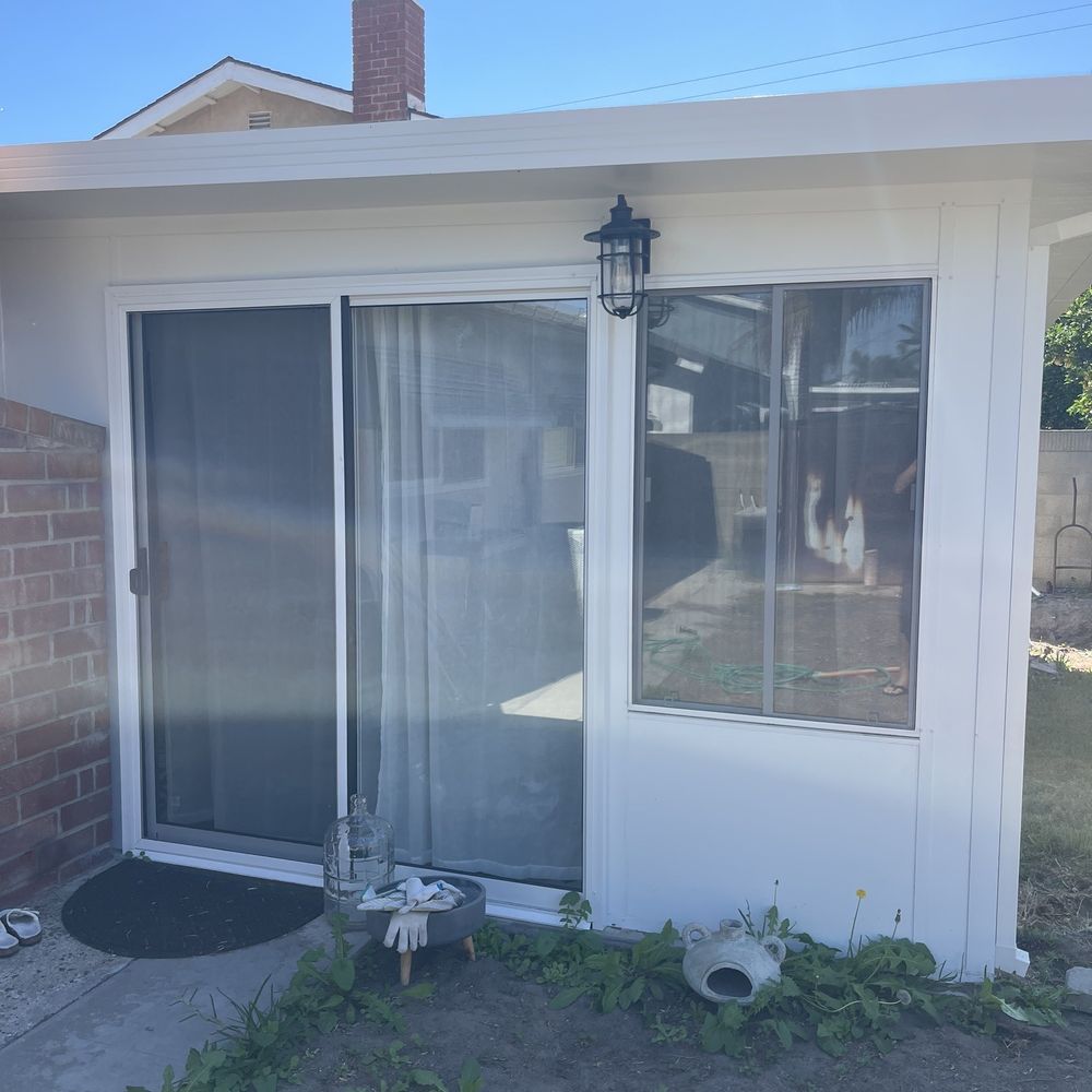 LJ Hausner Construction Company - Side with sliding glass door. All windows are dual pane, low e glass. - Patio Coverings Near Me - Tustin, California LJ Hausner Construction Company - Side with sliding glass door. All windows are dual pane, low e glass. - Patio Coverings Near Me - Tustin, California