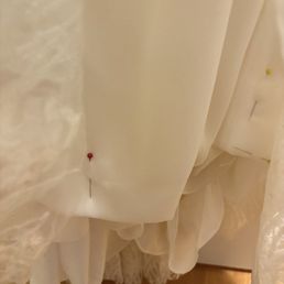 Pins she left in my dress from alterations that were supposed to be done in May (Picture is from July) Pins she left in my dress from alterations that were supposed to be done in May (Picture is from July)