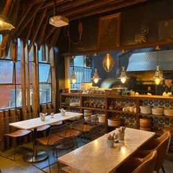 La Justina - Rear area dining with pizza oven in background