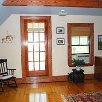 Vazquez Contracting - a living room with hardwood floors - General Contractors Near Me Vazquez Contracting - a living room with hardwood floors - General Contractors Near Me