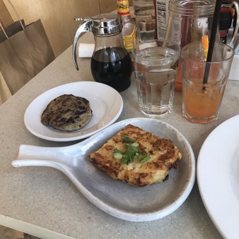 Wild Eggs - Hash brown casserole, turkey sausage, and tequila sunrise pitcher in the background. - Breakfast & Brunch Near Me - Indianapolis, Indiana Wild Eggs - Hash brown casserole, turkey sausage, and tequila sunrise pitcher in the background. - Breakfast & Brunch Near Me - Indianapolis, Indiana