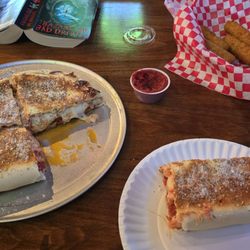 Retro Pizza - Pepperoni, sausage, extra cheese calzone (small) and mozzarella sticks