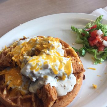 Gina's Cafe - CHICKEN AND WAFFLES- jalapeño cornbread waffle topped with fried chicken tenders, sausage gravy, and cheddar cheese. - Cafes Near Me - Clinton Township, Michigan Gina's Cafe - CHICKEN AND WAFFLES- jalapeño cornbread waffle topped with fried chicken tenders, sausage gravy, and cheddar cheese. - Cafes Near Me - Clinton Township, Michigan
