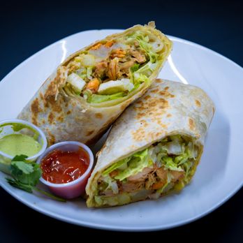 Watani Spot - two burritos on a white plate - Food Trucks Near Me - Burlingame, California Watani Spot - two burritos on a white plate - Food Trucks Near Me - Burlingame, California