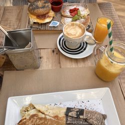 Baker & Co - Goa wrap- Chicken Tikka Masala, tomato jam goodness  Noho - Bagel & Pancake plate with orange juice