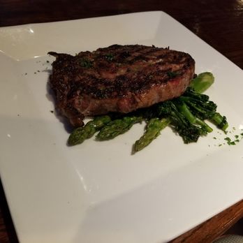 Back Room Steakhouse - Boneless Ribeye – 16 oz with Asparagus and Broccolini - Steakhouses Near Me - Apopka, Florida Back Room Steakhouse - Boneless Ribeye – 16 oz with Asparagus and Broccolini - Steakhouses Near Me - Apopka, Florida