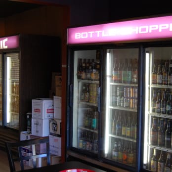 Volcanic Bottle Shoppe - two coolers and a table - Bars Near Me - Hood River, Oregon