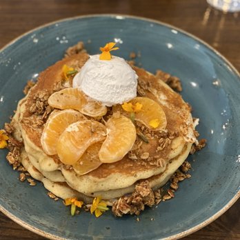 First Watch - Honey Crisp pancakes topped with oranges and granola - Breakfast & Brunch Near Me - Wesley Chapel, Florida