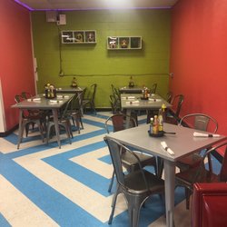 The Iron Daisy - There are a couple booths, another 5 top table not pictured, and 4 seats at the bar.