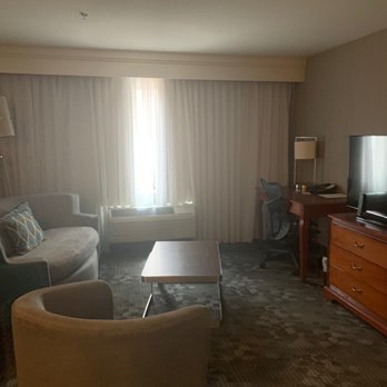 Courtyard by Marriott Los Angeles Burbank Airport - Hospitality suite . 1 king 2 pull out ( Shown here is one pull out sofa in the sitting area ) - Hotels Near Me - Burbank, California