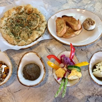 Jardin - Six-item mezze with pita, roasted garlic, butternut squash with pepitas and goat cheese, baba ghanoush, crudités with lemon aioli, and feta - Mediterranean Near Me - San Antonio, Texas Jardin - Six-item mezze with pita, roasted garlic, butternut squash with pepitas and goat cheese, baba ghanoush, crudités with lemon aioli, and feta - Mediterranean Near Me - San Antonio, Texas