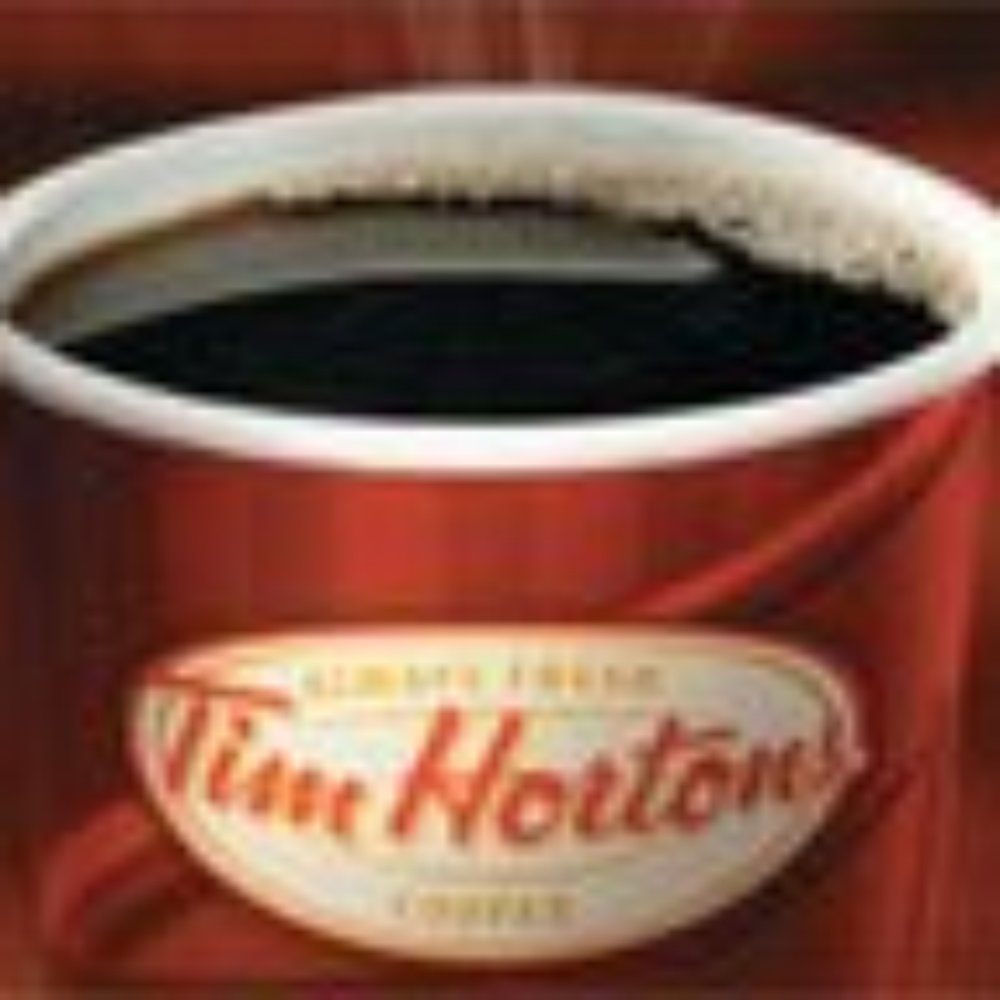 Tim Hortons - a cup of coffee on a table - Donuts Near Me - Westerville, Ohio Tim Hortons - a cup of coffee on a table - Donuts Near Me - Westerville, Ohio