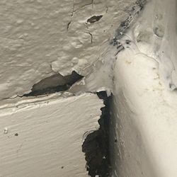iTrip Vacations Steamboat Springs - Black mold in the walls deteriorating the baseboard and coming through the caulk
