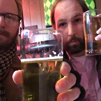Alpine Tap Room - two men holding glasses of beer - Bars Near Me - Des Moines, Iowa Alpine Tap Room - two men holding glasses of beer - Bars Near Me - Des Moines, Iowa