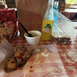 Rudy's "Country Store" and Bar-B-Q - 1/2 lb Turkey, potato salad and a pulled pork sandwich in the sack. Pineapple Juarritos and Frosti Blue Cream Soda.