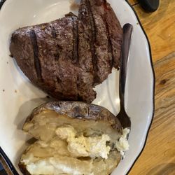 The Bunkhouse Bar and Grill - Top sirloin and baked potato with butter