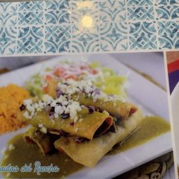 This is a pic of the dinner flautas with sauce and cheese. This is a pic of the dinner flautas with sauce and cheese.