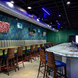 H G Roosters - View of the main bar and high top banquette seating
