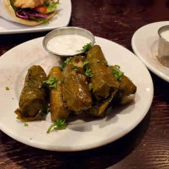 Olive Tree Mediterranean Restaurant - Dolmas - stuffed grape leaves with tzatziki. So dilly and yummy! - Mediterranean Near Me - Kent, Washington Olive Tree Mediterranean Restaurant - Dolmas - stuffed grape leaves with tzatziki. So dilly and yummy! - Mediterranean Near Me - Kent, Washington