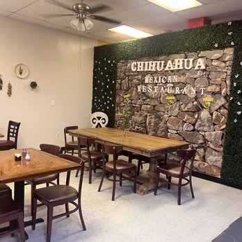 Chihuahua Mexican Restaurant - tables and chairs in front of a stone wall - Mexican Near Me - Houston, Texas Chihuahua Mexican Restaurant - tables and chairs in front of a stone wall - Mexican Near Me - Houston, Texas