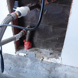 Open wall to access Water Main