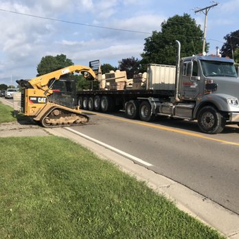 VanGordon Tree & Land Solutions - a tractor and a bulldozer - Excavation Services Near Me - Highland, Michigan