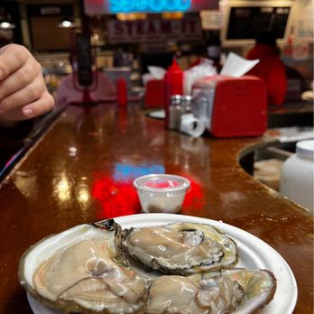 Faidley's Seafood - Oysters (3 for $7.50) and comes with horseradish and lemon. They have cocktail sauce, ketchup, salt, and pepper at the bar. - Seafood Markets Near Me - Baltimore, Maryland Faidley's Seafood - Oysters (3 for $7.50) and comes with horseradish and lemon. They have cocktail sauce, ketchup, salt, and pepper at the bar. - Seafood Markets Near Me - Baltimore, Maryland