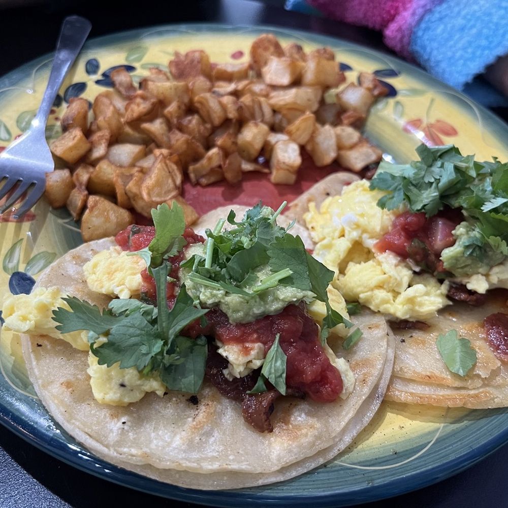 Thanks A Brunch - Gilbert - Bacon Breakfast Tacos: Tortillas stuffed with scrambled eggs, bacon, salsa, avocado, & cilantro served with house potatoes - Burgers Near Me - Gilbert, Arizona Thanks A Brunch - Gilbert - Bacon Breakfast Tacos: Tortillas stuffed with scrambled eggs, bacon, salsa, avocado, & cilantro served with house potatoes - Burgers Near Me - Gilbert, Arizona
