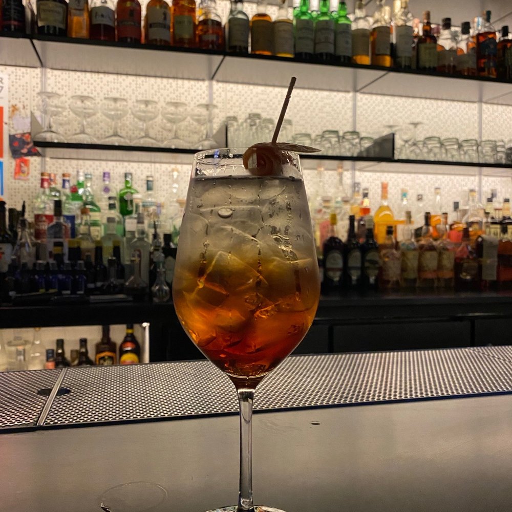 a drink in a glass on a bar a drink in a glass on a bar