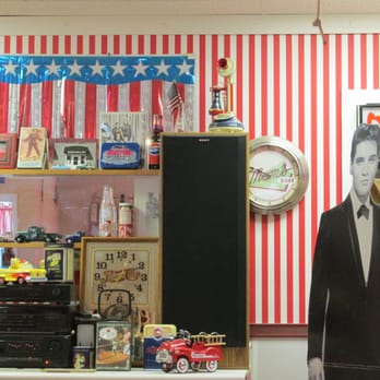Pisanello's Pizza - artifacts include life size cutout of Elvis Presley and various nik naks. - Pizza Near Me - Grand Rapids, Ohio Pisanello's Pizza - artifacts include life size cutout of Elvis Presley and various nik naks. - Pizza Near Me - Grand Rapids, Ohio