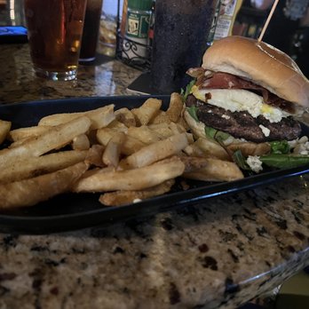 Three Birds Tavern - Black & Blue Burger with an egg and fries with Guinness gravy - American Near Me - St. Petersburg, Florida Three Birds Tavern - Black & Blue Burger with an egg and fries with Guinness gravy - American Near Me - St. Petersburg, Florida