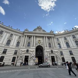 Hofburg - inner courtyard facade and archway of the Imperial Chancellory Wing (Reichskanzleitrakt) at the Hofburg Palace